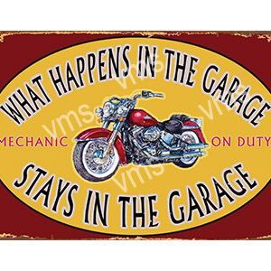 Vintage sign with a motorcycle and humorous garage quote.