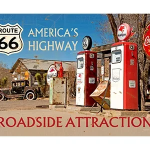 Vintage gas pumps and signs along historic Route 66 roadside.