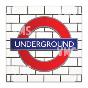 London Underground logo on a white brick wall.