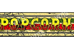 Vintage sign reading 'POPCORN' with distressed yellow and red letters on a cracked beige background.