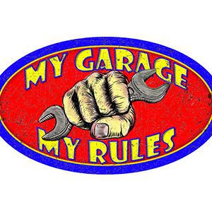 A logo with a fist holding a wrench and text saying My Garage My Rules.