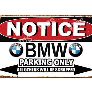 A sign indicating BMW parking only with a warning.