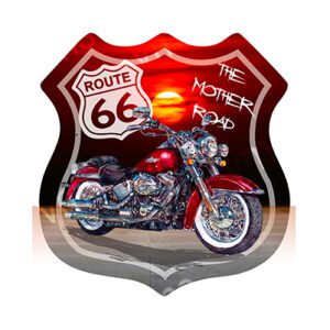 A classic motorcycle with a Route 66 sign and sunset background.