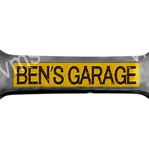 A black and yellow pillow with 'BEN'S GARAGE' text.