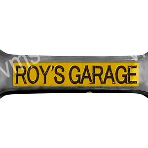A yellow and black sign reading "ROY'S GARAGE".