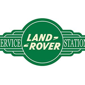 Vintage Land Rover service station logo in green and white.