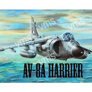 AV-8A Harrier jet flying over the ocean with a dramatic sky.