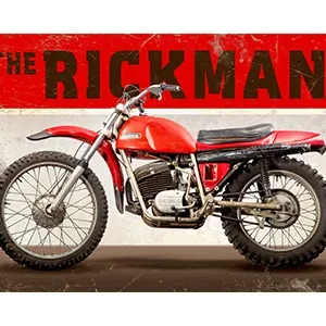 Classic red Rickman motorcycle against a vintage brick wall.