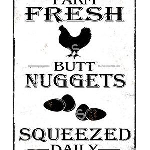 A vintage-style farm sign advertising fresh chicken and squeezed juice.