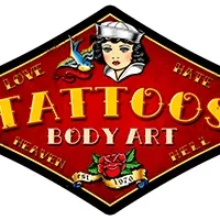 Vintage tattoo shop sign with classic sailor and heart designs.