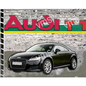 Black Audi TT sports car parked on a cobblestone street.