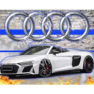 Sleek white Audi sports car parked in front of large Audi rings.