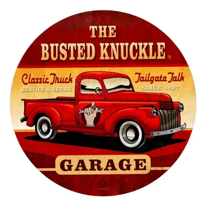 Vintage red truck logo for The Busted Knuckle Garage.