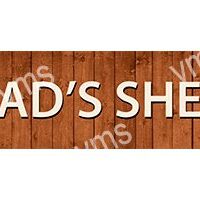 A wooden sign with the text "DAD'S SHE" in bold white letters.