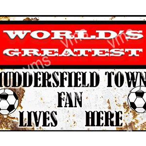 A vintage sign declaring a Huddersfield Town fan lives here.