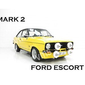 Yellow Ford Escort Mark 2 with additional front lights.