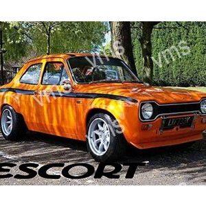 Classic orange Ford Escort car parked outdoors with custom wheels.
