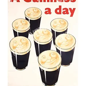 Six pints of Guinness with foam art and text saying 'A Guinness a day'.