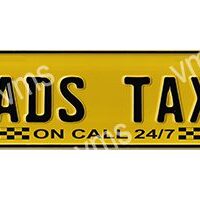 Yellow roadside assistance sign for 24/7 taxi service.