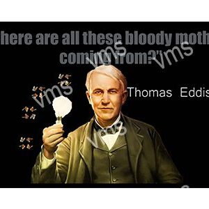Thomas Edison holding a glowing light bulb.
