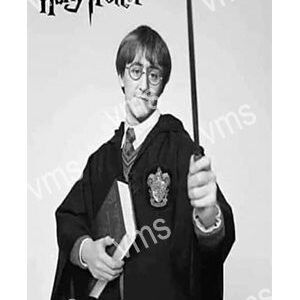 Black and white image of a young wizard with a wand and glasses.