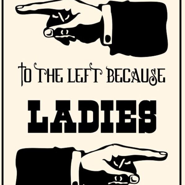 Vintage-style sign pointing left for ladies.