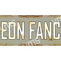 Rusty metal sign with large white letters.