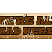 Wooden sign reading 'We're all mad here' with a rustic design.