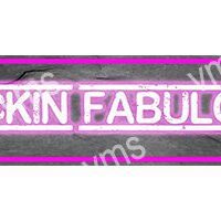 Neon sign reading 'SKIN FABULOUS' in bright pink.