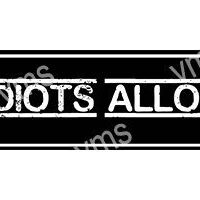 Black and white sign with text about idiots not being allowed.