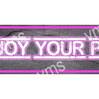 Neon pink sign with partial text on a dark background.
