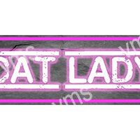 Neon sign reading 'CAT LADY' in pink and white colors.