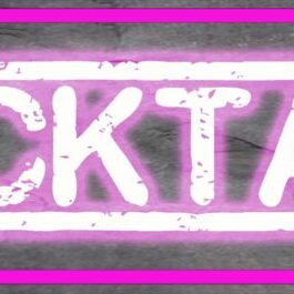 A glowing pink neon sign displaying the word 'COCKTAIL'.