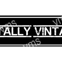 A black and white sign reading 'TOTALLY VINTAGE'.