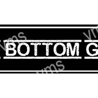 A black and white sign with the text 'BOTTOM G'.