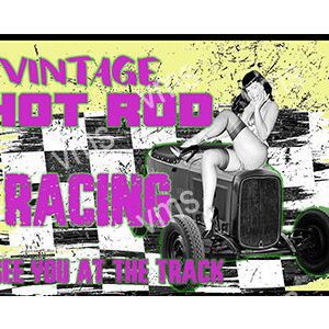 Vintage hot rod racing at a lively outdoor event.