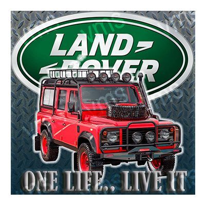 Red Land Rover Defender parked in front of a Land Rover sign.
