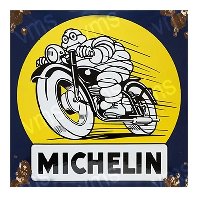 Vintage Michelin sign with the iconic Bibendum character riding a motorcycle.