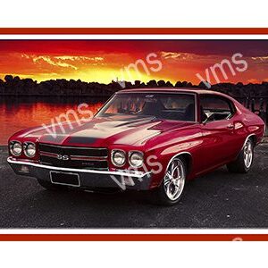 Classic red muscle car parked at sunset with vibrant sky.