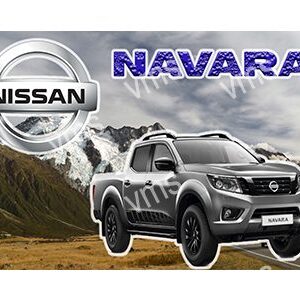 Nissan Navara truck driving on rugged terrain with mountains in the background.
