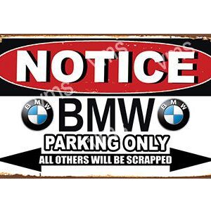 A sign indicating BMW parking only with a warning.