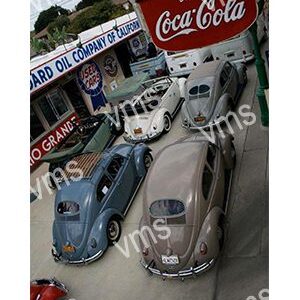 Vintage cars displayed in a classic automotive showroom with nostalgic signs.