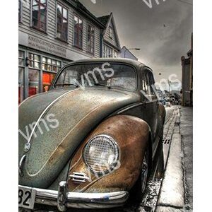 Vintage Volkswagen Beetle parked on a city street with muted colors.