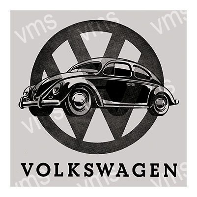 Vintage Volkswagen Beetle with classic VW logo background.