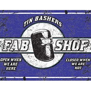 Vintage metal sign for Tin Bashers Fab Shop with a worn look.