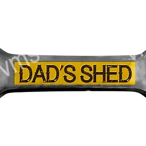 A wrench with a yellow label reading 'DAD'S SHED'.