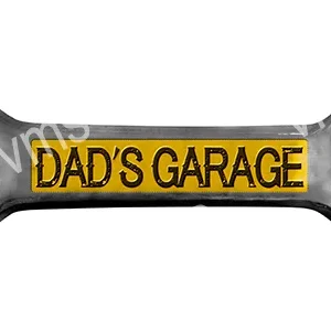 A rectangular sign that reads "DAD'S GARAGE" in bold black letters on a yellow background.