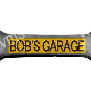 A wrench with 'BOB'S GARAGE' printed in yellow on a black background.