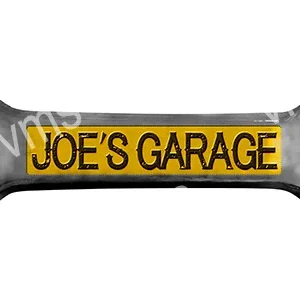 A yellow and black car air freshener with 'JOE'S GARAGE' text.