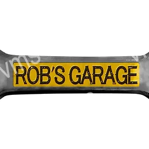 A black and yellow garage sign reading 'ROB'S GARAGE'.